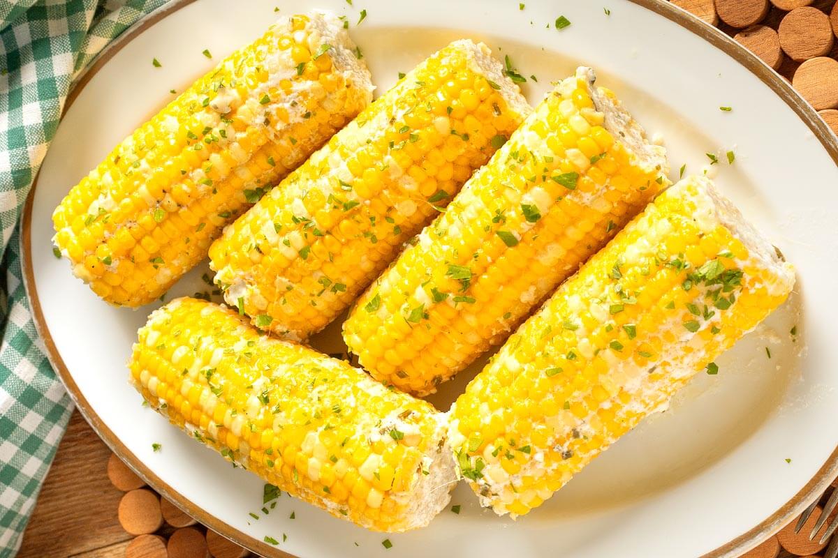 5 Corn on the Cob on a white plate