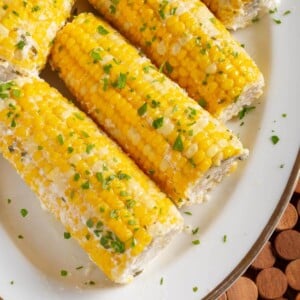 5 Corn on the Cob on a white plate