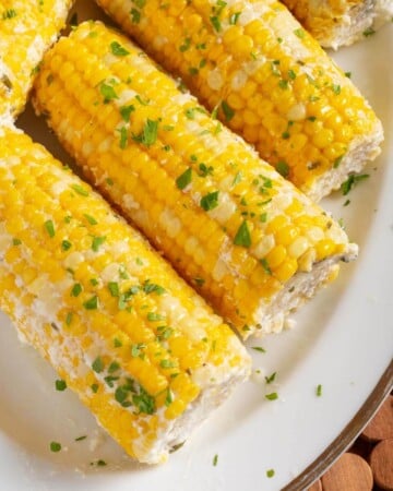 5 Corn on the Cob on a white plate