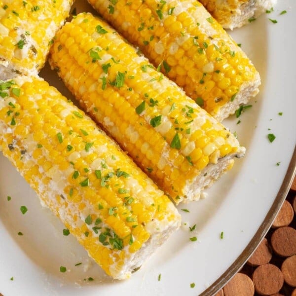 5 Corn on the Cob on a white plate