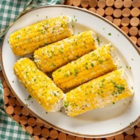 5 Corn on the Cob on a white plate