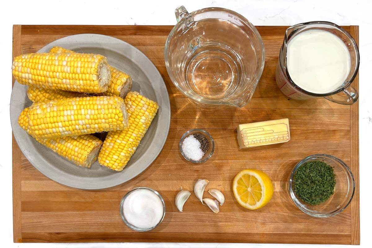 Flavorful Boiled Corn on the Cob ingredients shot on a board