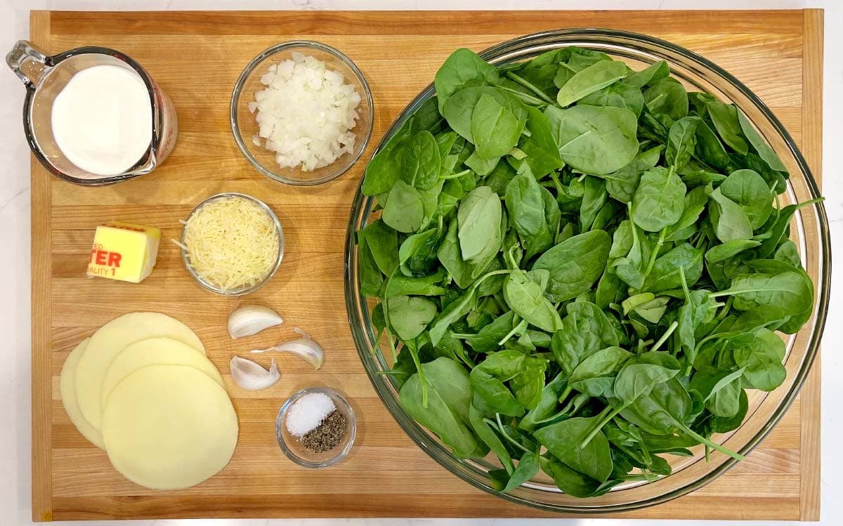 Cheesy Creamed Spinach ingredients shot on a board