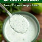 Cilantro Cream Sauce in a green bowl with a spoon