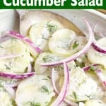 Creamy Dill Cucumber Salad in a white bowl closeup.