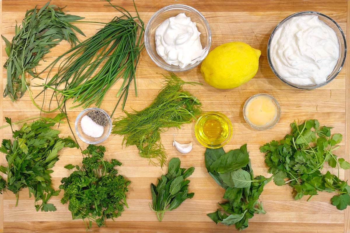 Creamy Herb Yogurt Dressing ingredients shot on board