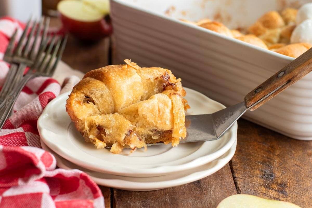 Crescent Roll Apple Dumpling on a spatula with plate