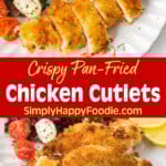 Crispy Pan-Fried Chicken Cutlets on a white plate with salad