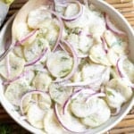 Creamy Dill Cucumber Salad in a white bowl closeup.
