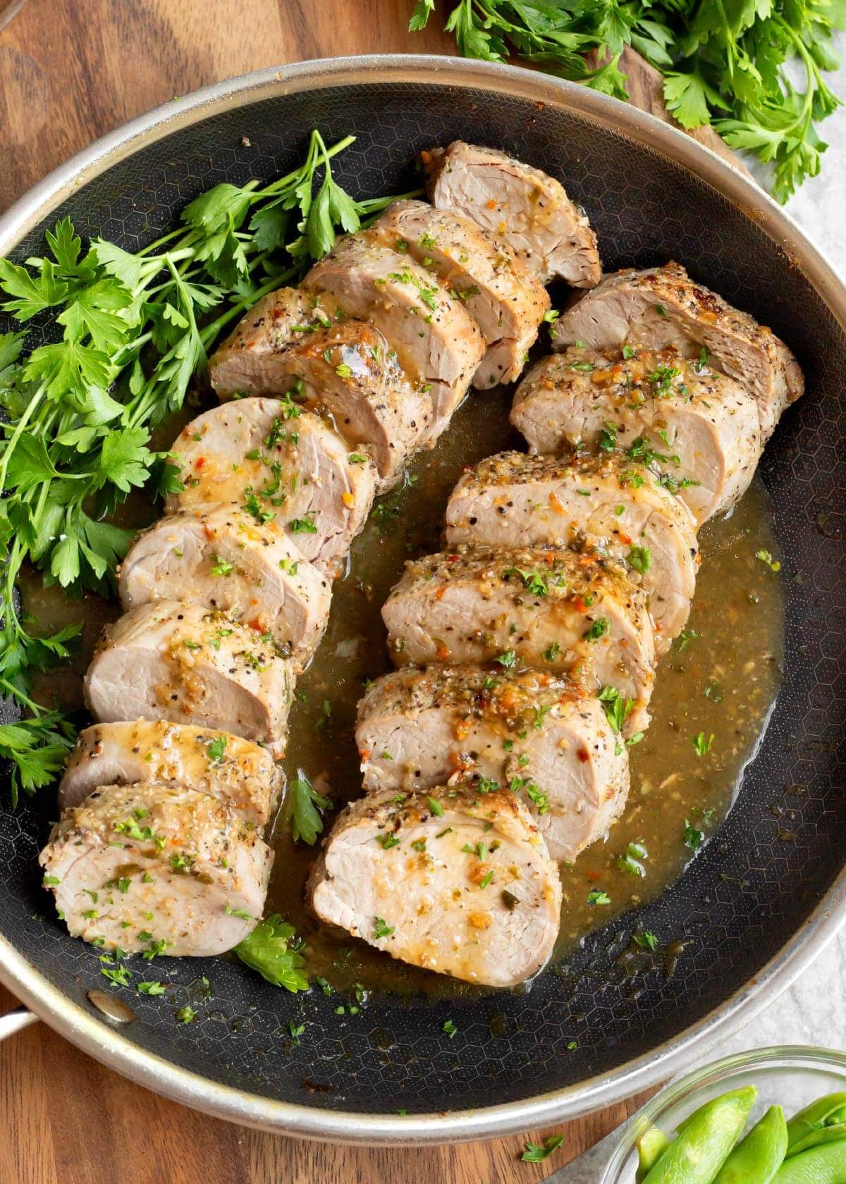 2 Easy Baked Pork Tenderloin sliced in a skillet