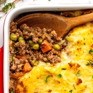 Irish Cottage Pie in a baking dish with wooden spoon