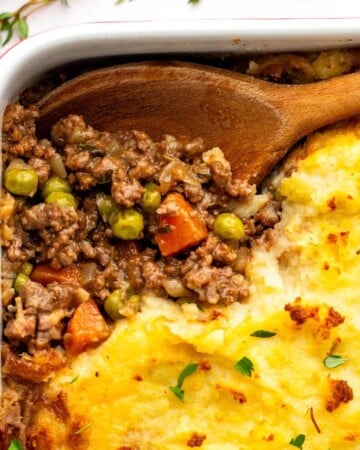 Irish Cottage Pie in a baking dish with wooden spoon