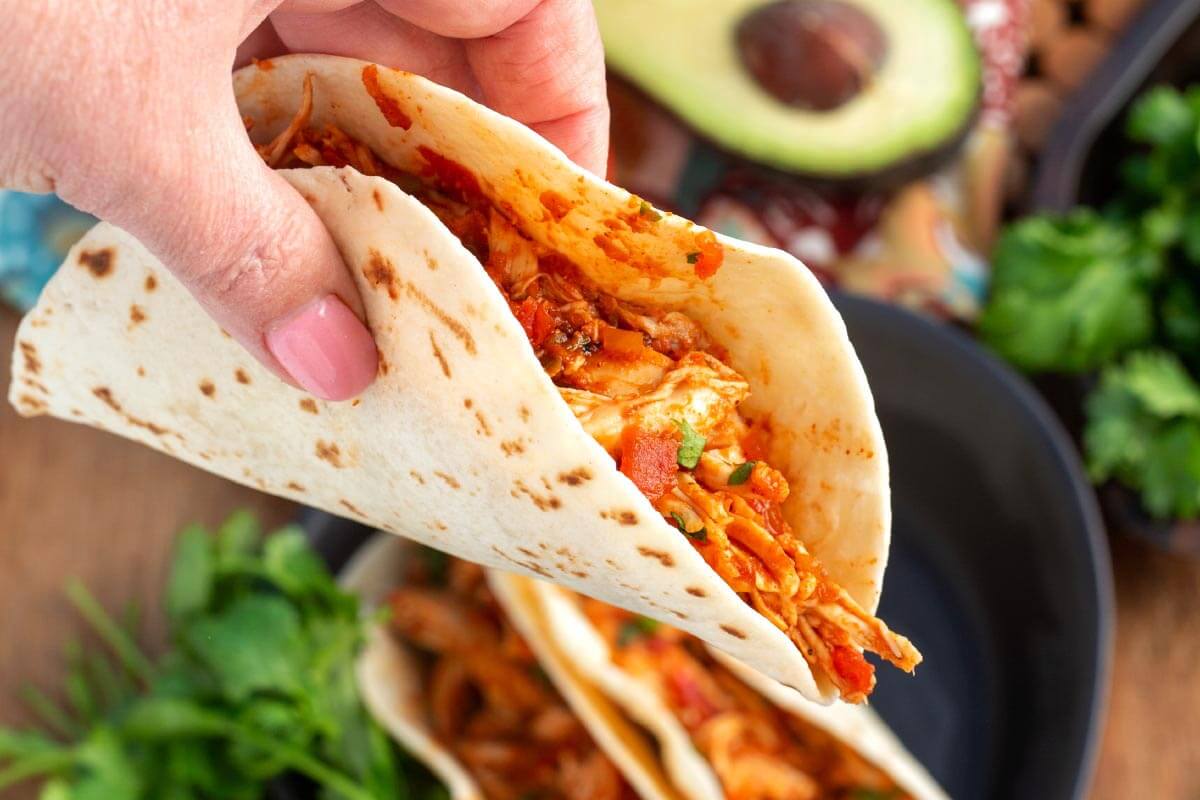 hand holding a Salsa Chicken taco