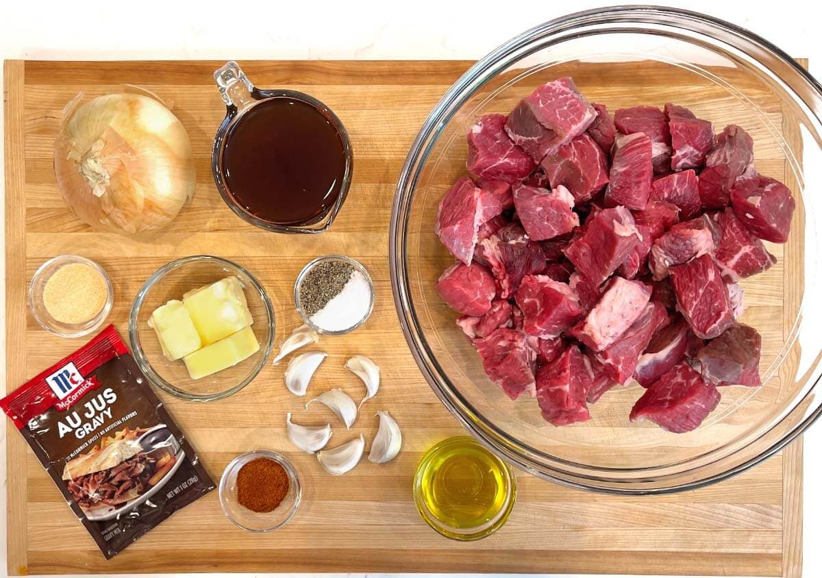 Slow Cooker Garlic Butter Steak Bites ingredients shot on a board.