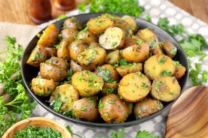 Slow Cooker Garlic Herb Potatoes in a black bowl