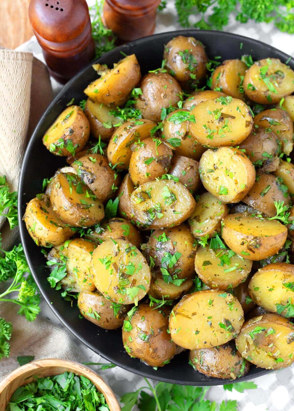 Slow Cooker Garlic Herb Potatoes in a black bowl