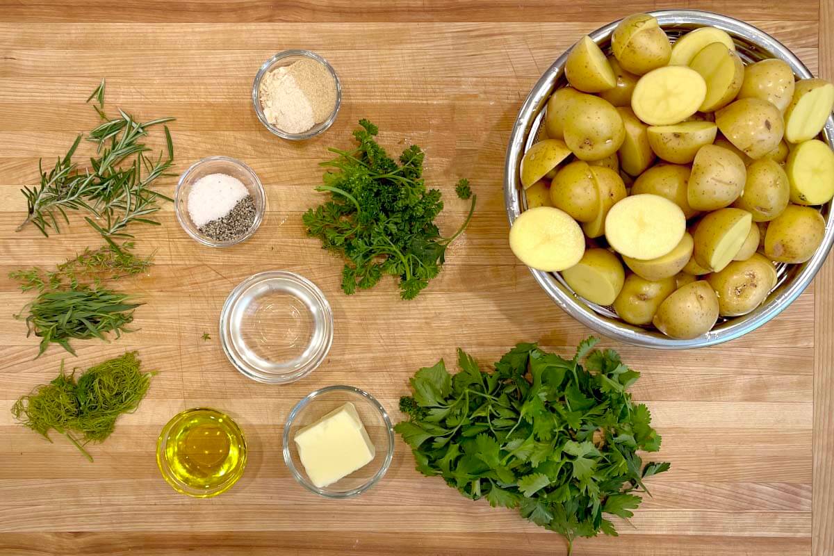 Slow Cooker Garlic Herb Potatoes ingredients shot on a board