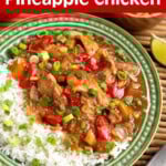 Slow Cooker Pineapple Chicken on a green plate with rice