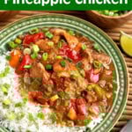 Slow Cooker Pineapple Chicken on a green plate with rice