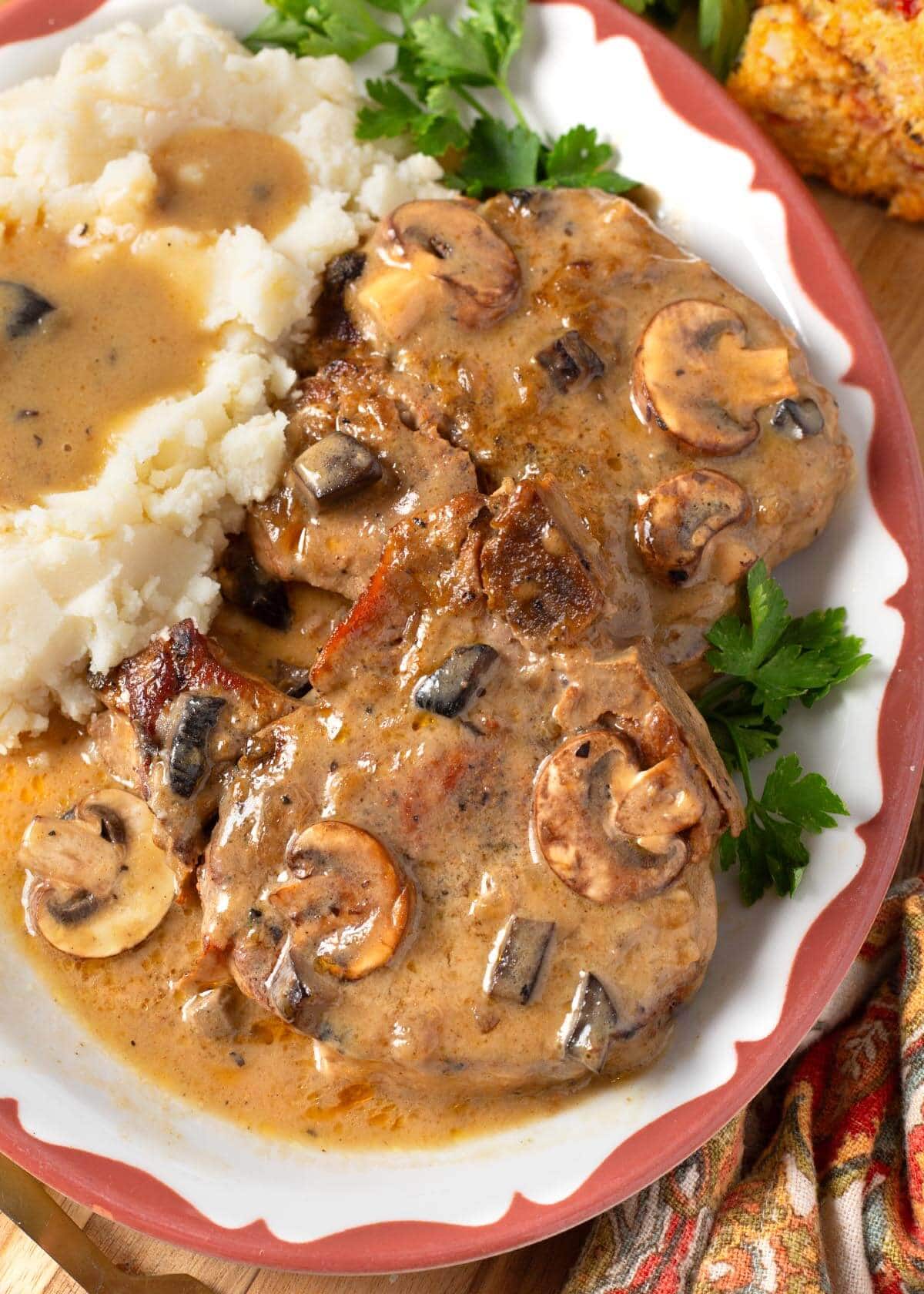 Slow Cooker Pork Chops with Mushroom Gravy and mashed potatoes