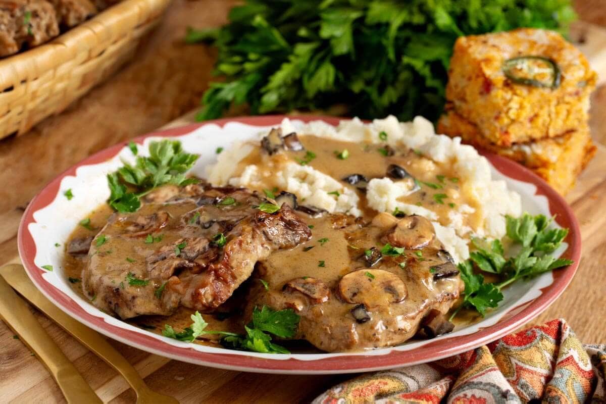 Slow Cooker Pork Chops with Mushroom Gravy and mashed potatoes