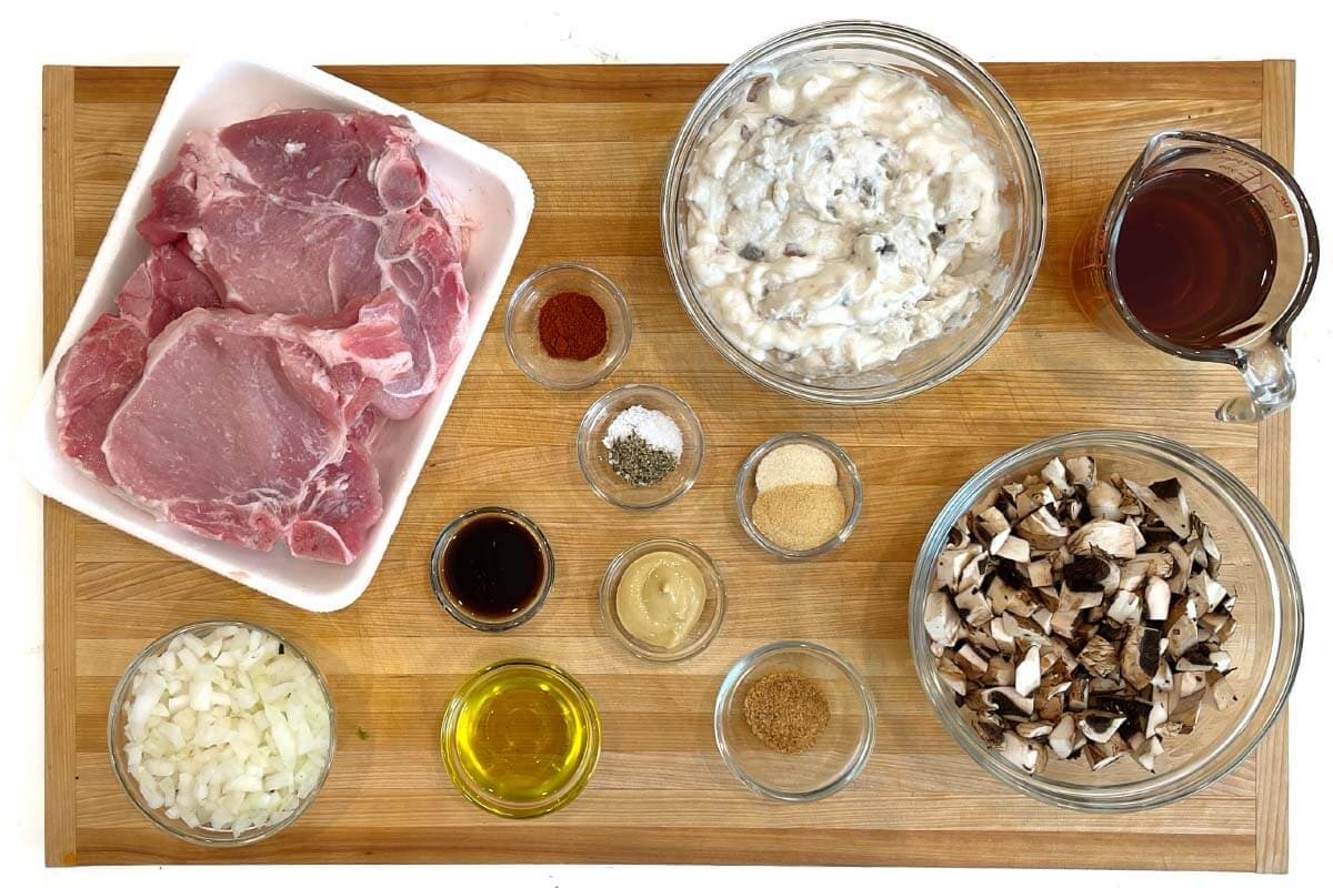 ingredients shot on board of pork chops and spices