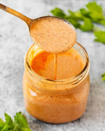 Southwest Buttermilk Chicken Marinade in a mason jar with a spoon