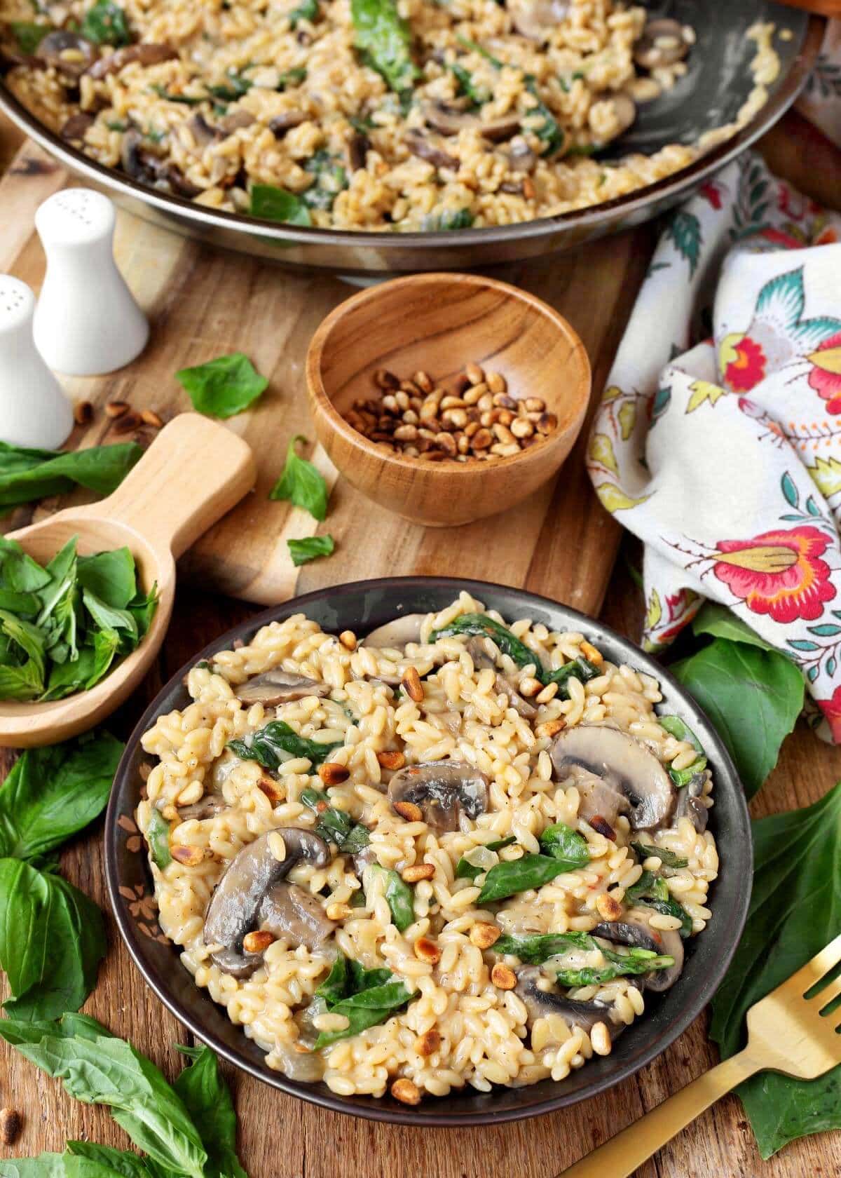 Spinach Mushroom Orzo in a bowl with garnishes