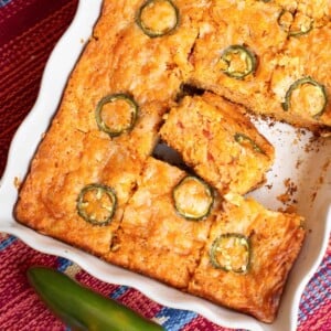 Tex-Mex Cornbread in a pan, sliced, with one slice on its side