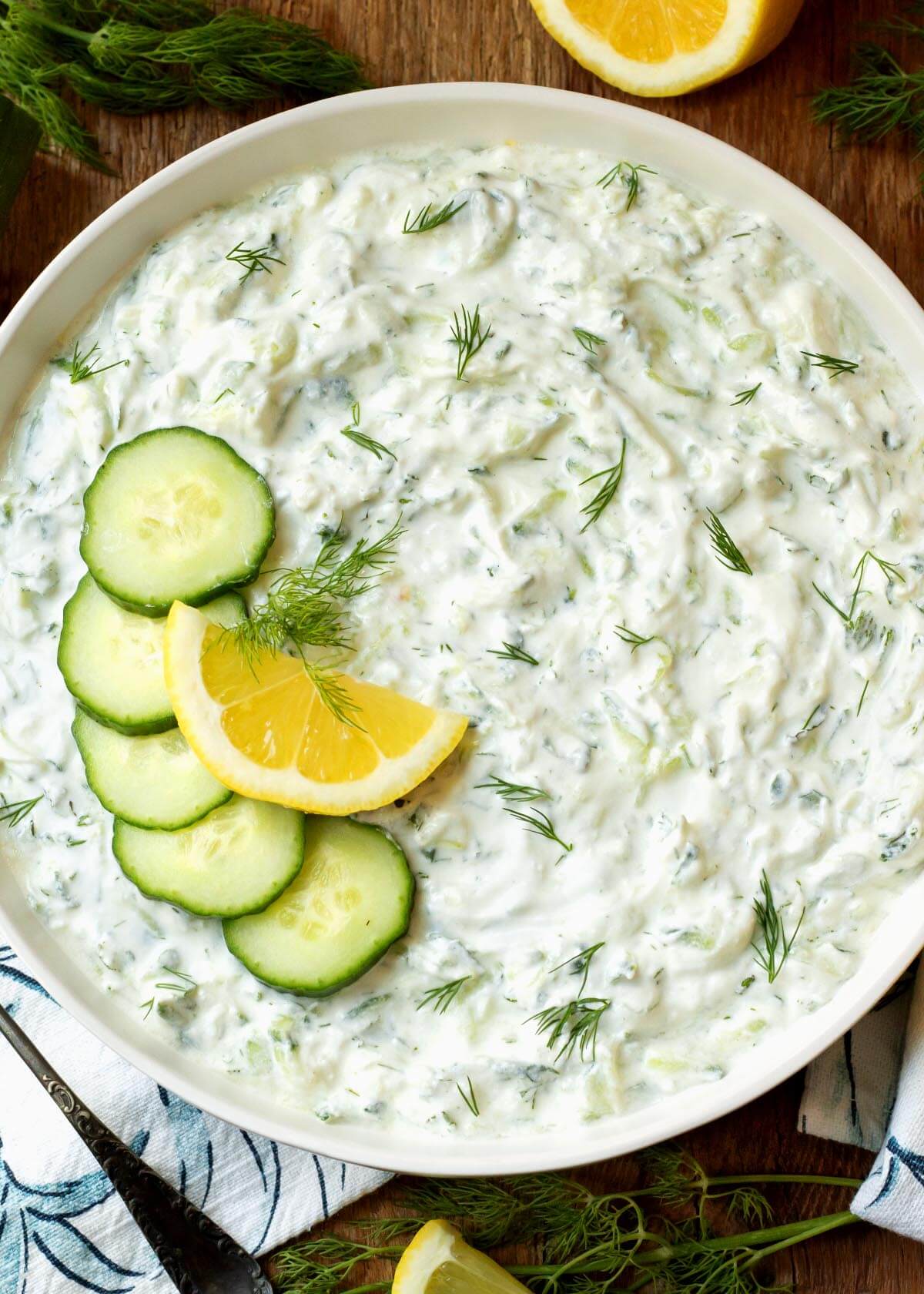 Tzatziki Sauce in a bowl with garnishes