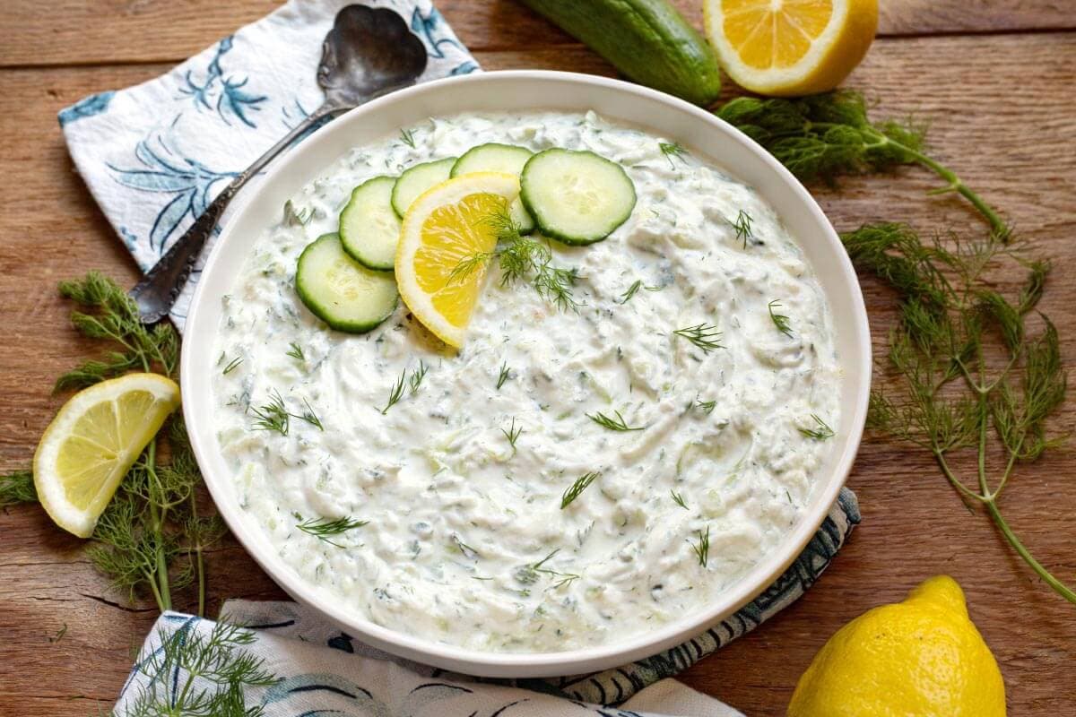 Tzatziki Sauce in a bowl with garnishes