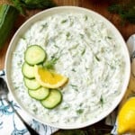 Tzatziki Sauce in a bowl with garnishes