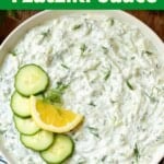 Tzatziki Sauce in a bowl with garnishes