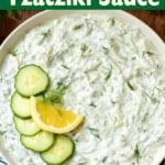 Tzatziki Sauce in a bowl with garnishes