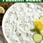 Tzatziki Sauce in a bowl with garnishes