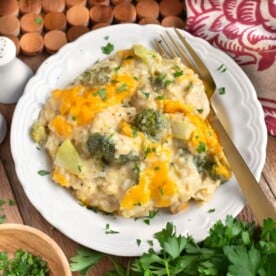 Cheesy Chicken Broccoli Rice Casserole on white plate with fork