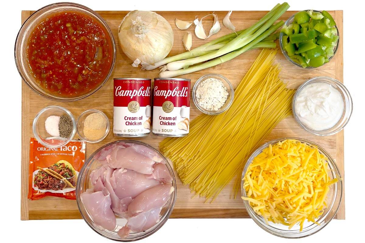 Crockpot Taco Ranch Chicken Spaghetti recipe ingredients shot on a board