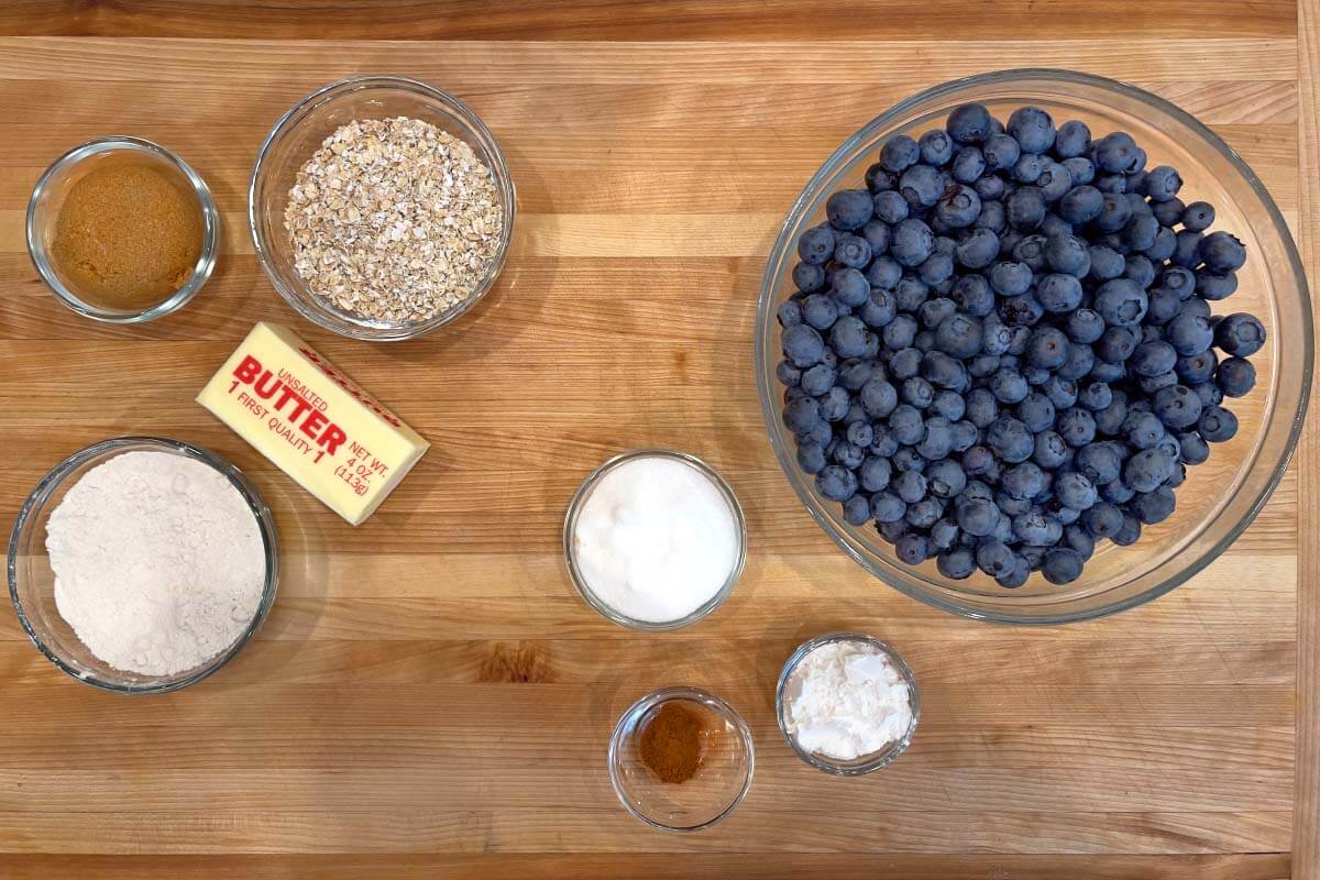 Blueberry Crisp recipe ingredients shot on a board