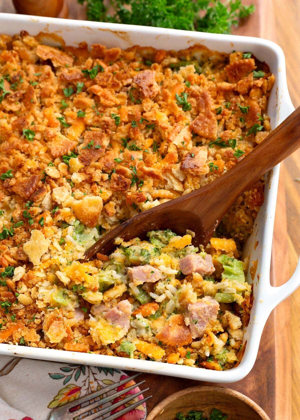 Ham and Broccoli Rice Bake closeup with wood spoon