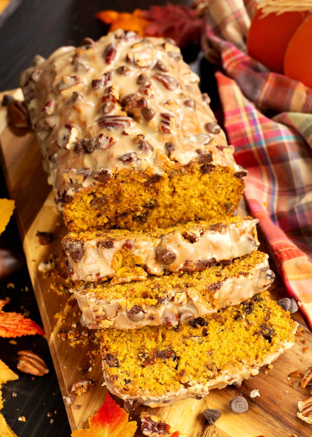 This Maple Chocolate Chip Pumpkin Bread is the ultimate fall baking recipe! It’s soft, moist, and full of warm pumpkin spice flavor, with sweet bursts of chocolate chips, chewy dried cranberries, and crunchy pecans. The real star, though, is the maple syrup—used both in the batter and in a silky Maple Cinnamon Glaze that gets brushed over the top. Perfect for fall gatherings, holiday brunches, or just enjoying with a hot cup of coffee.