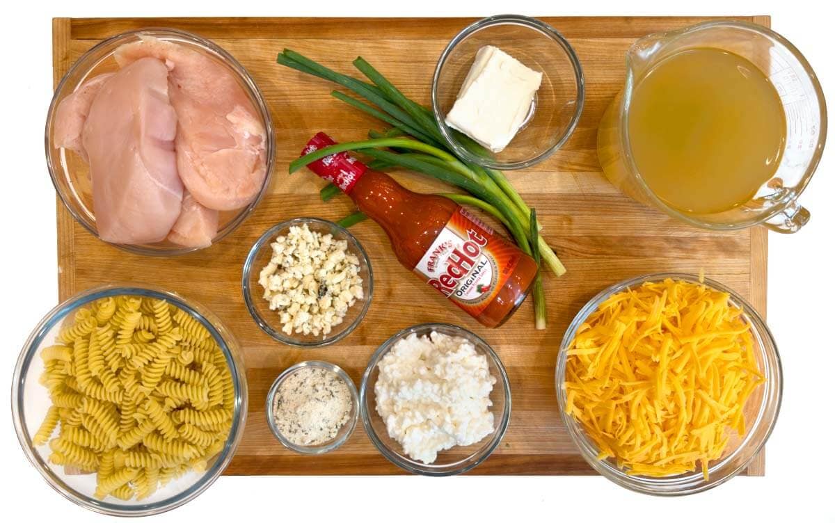 Crockpot Buffalo Chicken Mac and Cheese ingredients shot on a board