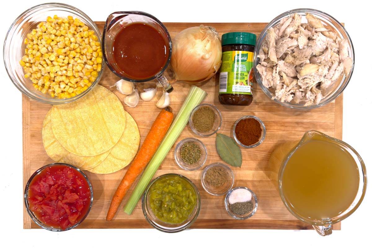 Crockpot Chicken Tortilla Soup ingredients on a board