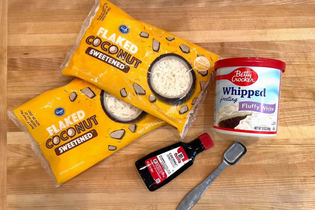 Easy Coconut Cake frosting ingredients shot on a board