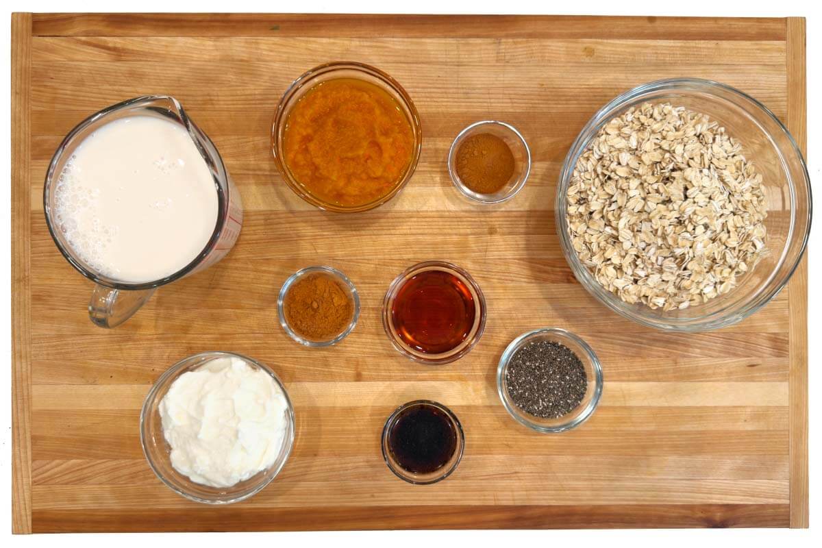 Pumpkin Overnight Oats ingredients on a board