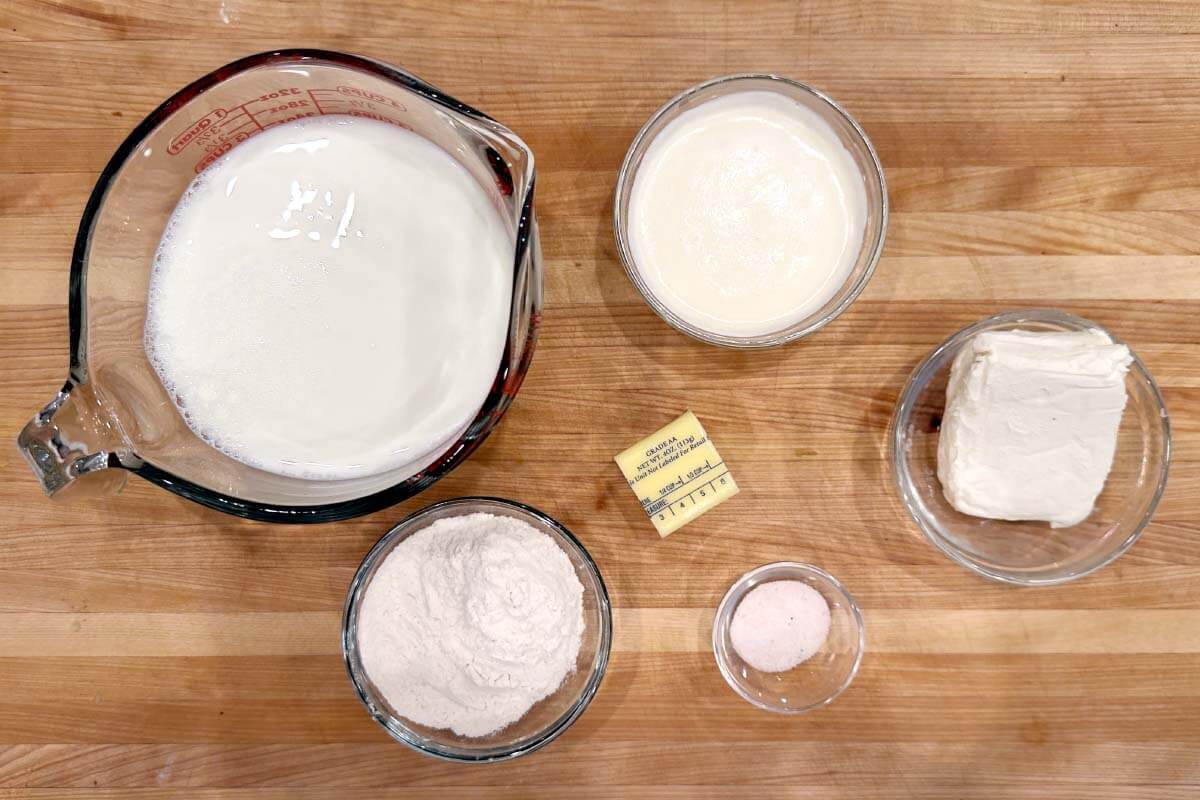 Homemade Creamy Vegetable Soup cream sauce ingredients shot on a board