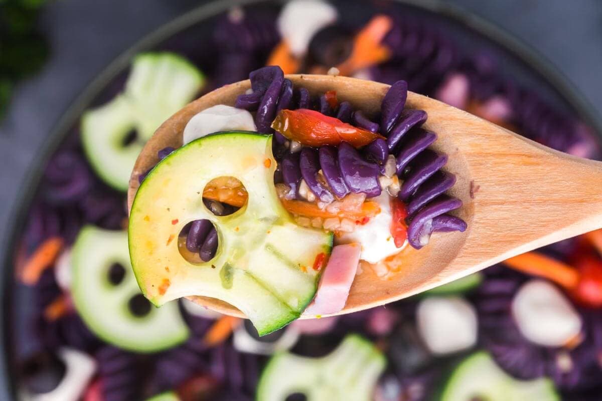 Purple Skull Halloween pasta salad decorated with cucumber skulls