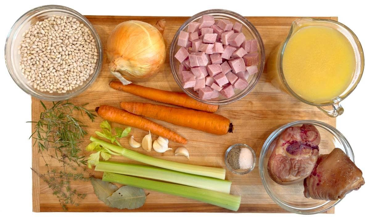 crock pot Ham and Bean Soup ingredients shot on a board