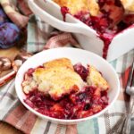 plum cobbler in a white dish