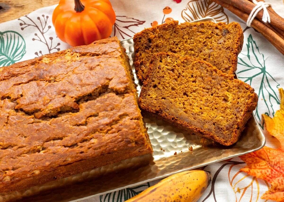 loaf of pumpkin banana bread partially sliced