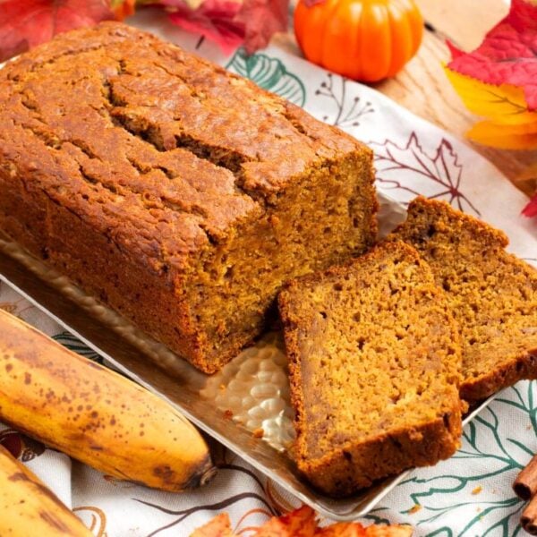 loaf of pumpkin banana bread partially sliced